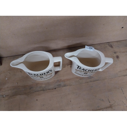 340 - Two Teachers Highland Cream Scotch Whiskey water jugs. {13 cm H x 28 cm W}.