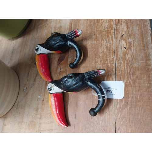 368 - Two cast iron Toucans. {18 cm H x 7 cm W}.