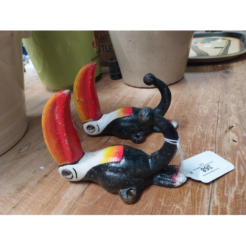 368 - Two cast iron Toucans. {18 cm H x 7 cm W}.