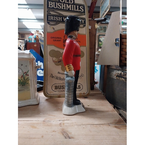 381 - Canadian Whiskey bottle in form of a Grenadier Guard. {42 cm H x 13 cm W x 10 cm D}.