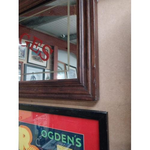 39 - Framed Carriages advertising mirror. {31 cm H x 64 cm W}.