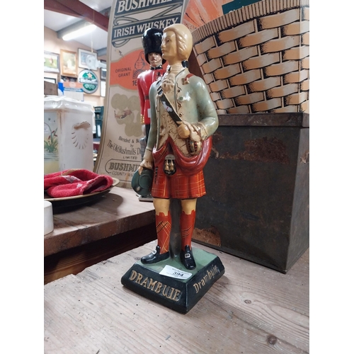 394 - Drambuie Ruberoid advertising figure. {34 cm H x 11 cm W x 11 cm D}.