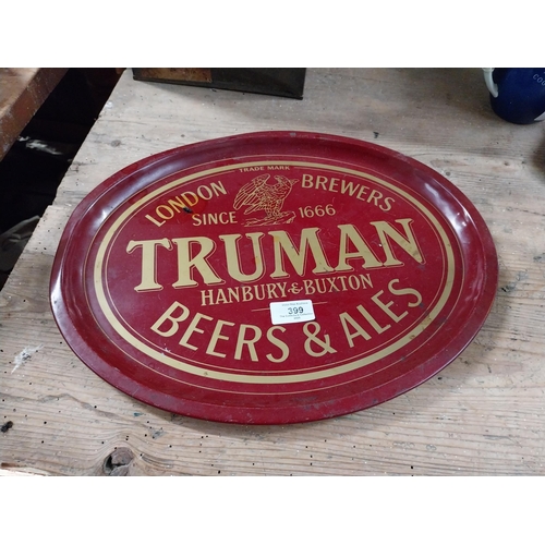 399 - Trumans Beer and Ales tin plate advertising tray. {3 cm H x 31 cm Dia.}.