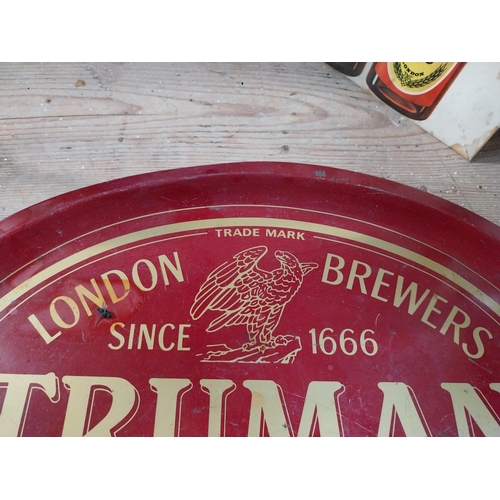 399 - Trumans Beer and Ales tin plate advertising tray. {3 cm H x 31 cm Dia.}.