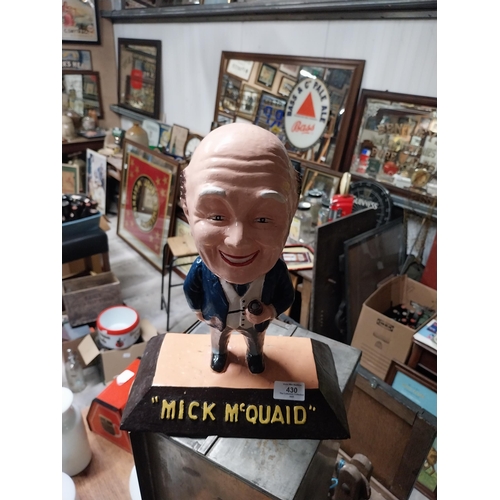 430 - Mick McQuaid composition advertising figure. {24 cm H x 28 cm W x 16 cm D}.