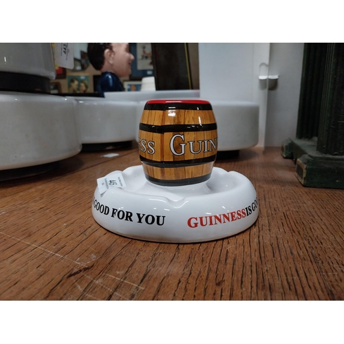 445 - Guinness ceramic advertising matchstrike. {9 cm H x 15 cm Diam.}.