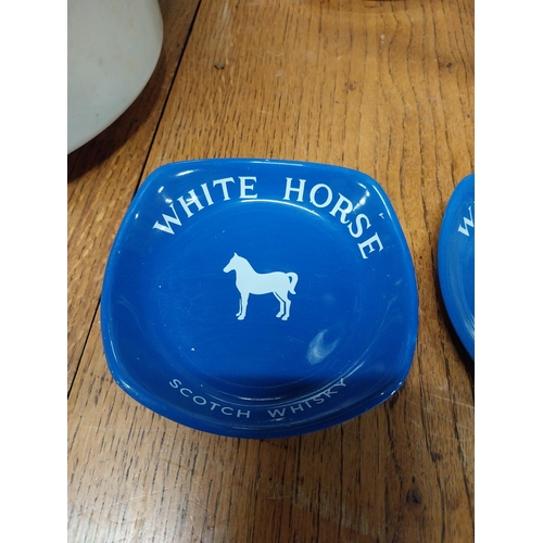 470 - Two White Horse Scotch Whiskey Wade ceramice advertising ashtrays. {3 cm H x 14 cm W x 14 cm D}.