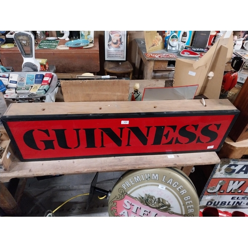 472 - Guinness light up advertising sign. {21 cm H x 117 cm W x 13 cm D}.