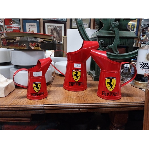 473 - Set of three graduated Ferrari oil measures. {27 cm H x 26 cm W x 15 cm W to 18 cm H x 17 cm W x 10 ... 