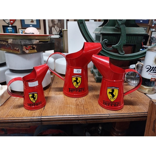 473 - Set of three graduated Ferrari oil measures. {27 cm H x 26 cm W x 15 cm W to 18 cm H x 17 cm W x 10 ... 