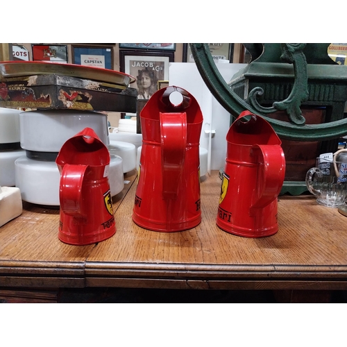 473 - Set of three graduated Ferrari oil measures. {27 cm H x 26 cm W x 15 cm W to 18 cm H x 17 cm W x 10 ... 