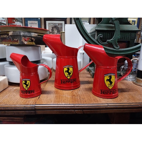 473 - Set of three graduated Ferrari oil measures. {27 cm H x 26 cm W x 15 cm W to 18 cm H x 17 cm W x 10 ... 