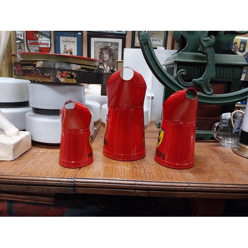 473 - Set of three graduated Ferrari oil measures. {27 cm H x 26 cm W x 15 cm W to 18 cm H x 17 cm W x 10 ... 