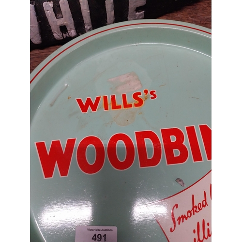 491 - Wills's Woodbine tin plate drink's tray. {2 cm H x 32 cm Dia.}.