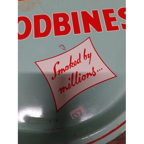 491 - Wills's Woodbine tin plate drink's tray. {2 cm H x 32 cm Dia.}.