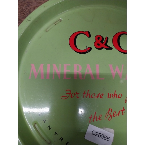 493 - C and C Mineral Waters tin plate drink's tray. {2 cm H x 32 cm Dia.}.