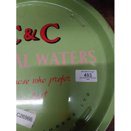 493 - C and C Mineral Waters tin plate drink's tray. {2 cm H x 32 cm Dia.}.