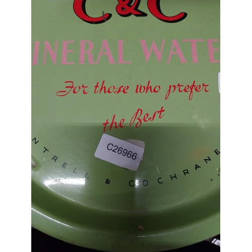 493 - C and C Mineral Waters tin plate drink's tray. {2 cm H x 32 cm Dia.}.