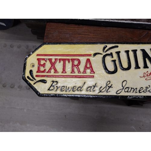 496 - Extra Guinness Stout cast iron advertising sign. {11 cm H x 56 cm W}.