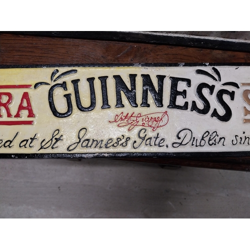 496 - Extra Guinness Stout cast iron advertising sign. {11 cm H x 56 cm W}.