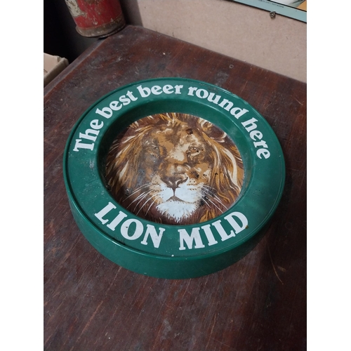 5 - Two plastic Best Beer Round Here Lion Bitter advertising ashtrays. {4 cm H x 21 cm Dia.}.