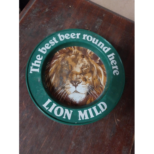 5 - Two plastic Best Beer Round Here Lion Bitter advertising ashtrays. {4 cm H x 21 cm Dia.}.