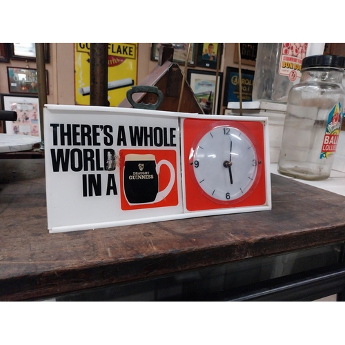 508 - There's a Whole World in a Guinness perspex advertising Clock. {15 cm H x 31 cm W x 7 cm D}.