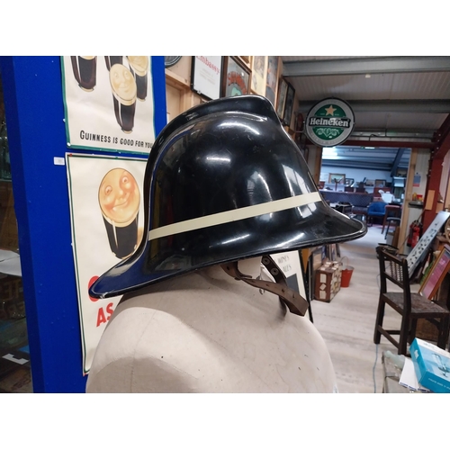 521 - Firemans Helmet from Ballycastle Fire Station. {19 cm H x 21 cm W x 37 cm D}.