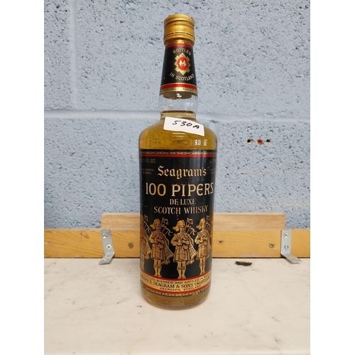 530A - Bottle of Seagram's 100 Pipers Scotch Whiskey. {30 cm H x 7 cm Dia.}.