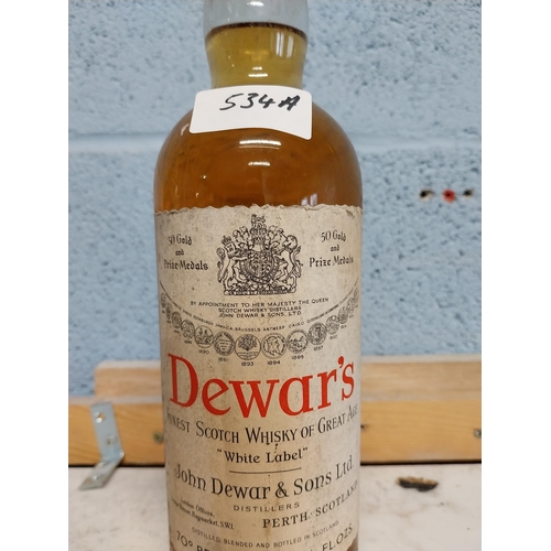 534A - Dewars Scotch Whiskey. {30 cm H x 8 cm Dia.}.