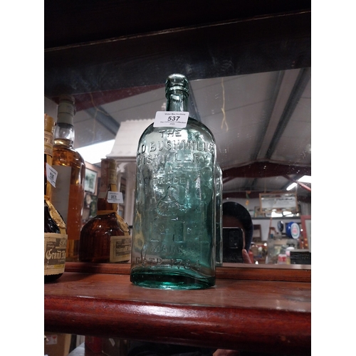 537 - The Bushmills Whiskey Distillery Imperal Pint Bottle. {24 cm H x 6 cm W}.