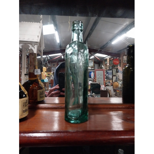 537 - The Bushmills Whiskey Distillery Imperal Pint Bottle. {24 cm H x 6 cm W}.