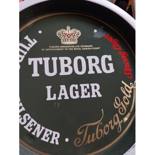 54 - Two Tuborg Lager tin  plate drinks tray. {27 cm Dia}.