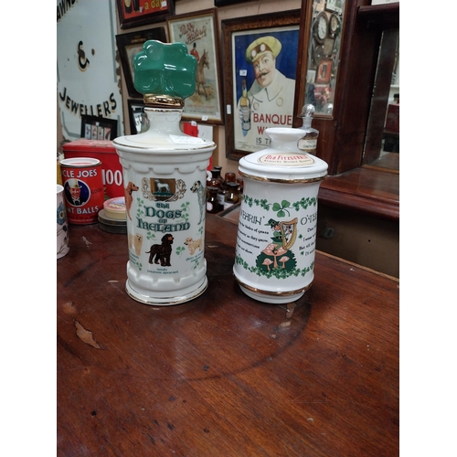 540A - Two ceramic advertising whiskey bottles The Wearing of the Green and The Dogs of Ireland. {2 cm H x ... 