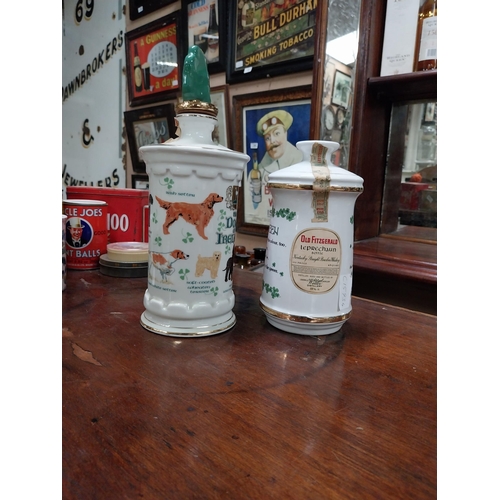 540A - Two ceramic advertising whiskey bottles The Wearing of the Green and The Dogs of Ireland. {2 cm H x ... 