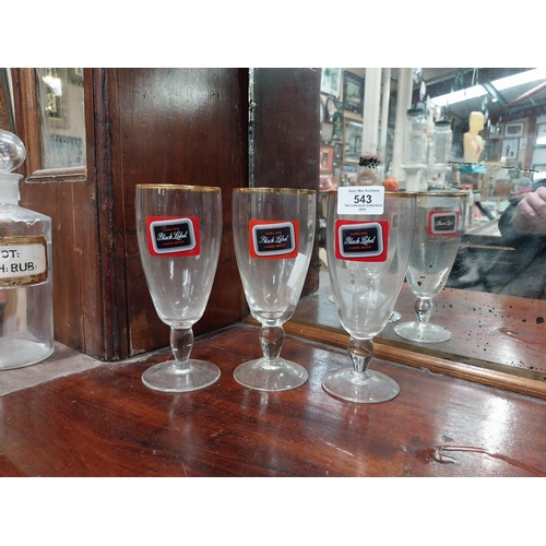 543 - Three Carling Black Label glasses. {17 cm H x 8 cm Dia.} and Three Celebration Ale glasses. {12 cm H... 