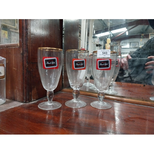 543 - Three Carling Black Label glasses. {17 cm H x 8 cm Dia.} and Three Celebration Ale glasses. {12 cm H... 