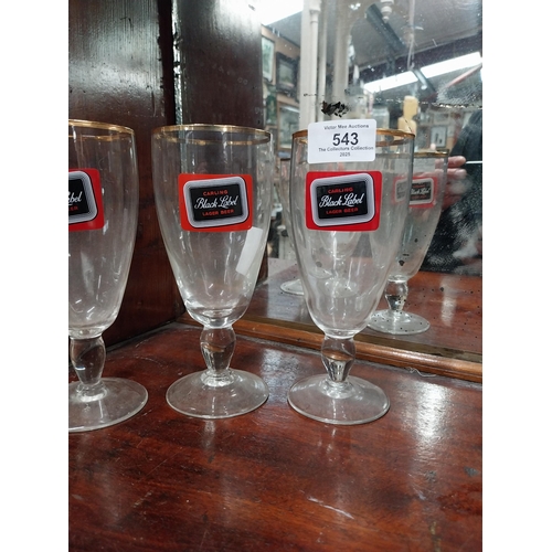 543 - Three Carling Black Label glasses. {17 cm H x 8 cm Dia.} and Three Celebration Ale glasses. {12 cm H... 