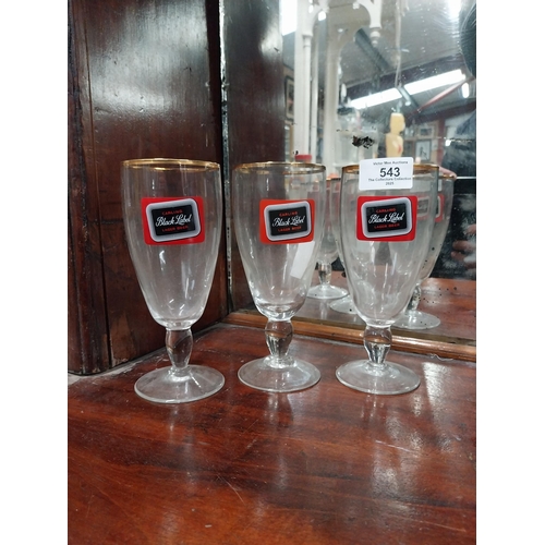 543 - Three Carling Black Label glasses. {17 cm H x 8 cm Dia.} and Three Celebration Ale glasses. {12 cm H... 