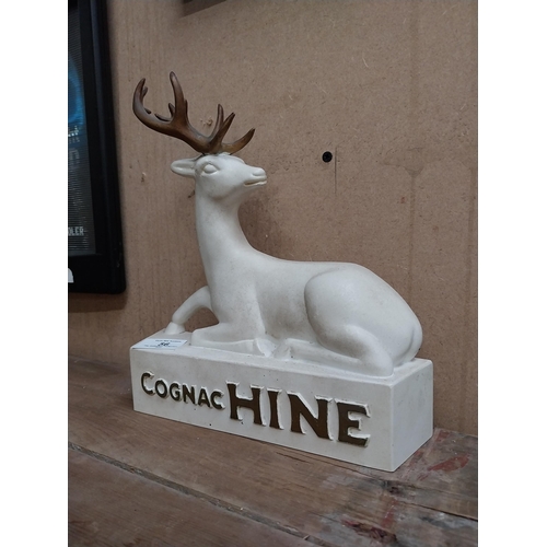 56 - Cognac Hine Ruberoid advertising figure. {25 cm H x 22 cm W x 6 cm D}.