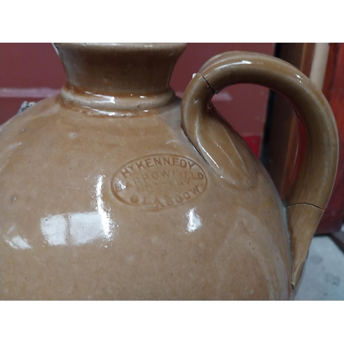 565 - M and T Clarke Longford two gallon stoneware flagon. {38 cm H x 20 cm Dia.}.