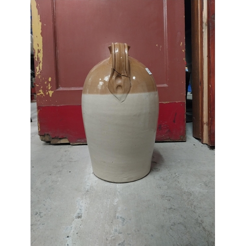 565 - M and T Clarke Longford two gallon stoneware flagon. {38 cm H x 20 cm Dia.}.