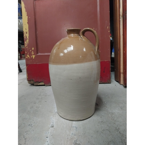 565 - M and T Clarke Longford two gallon stoneware flagon. {38 cm H x 20 cm Dia.}.