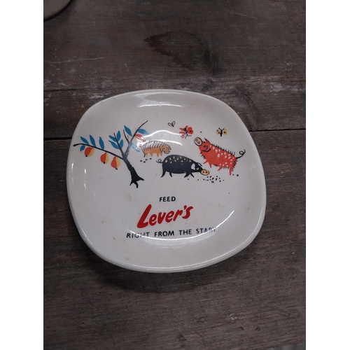 568 - Woodbine ceramic ashtray {12 cm W x 12 cm D} and Feed Levers Right From the Start. {10 cm H x 10 cm ... 