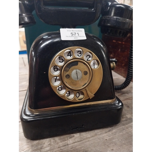 571 - 1940's bakelite wind up telephone. {25 cm H x 25 cm W x 14 cm D}.