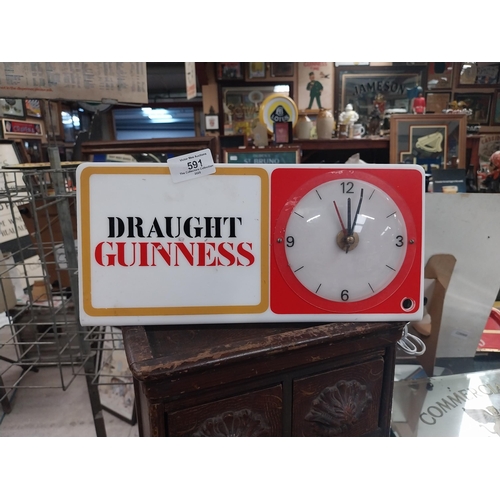 591 - Draught Guinness perspex advertising clock. {15 cm H x 31 cm W}.