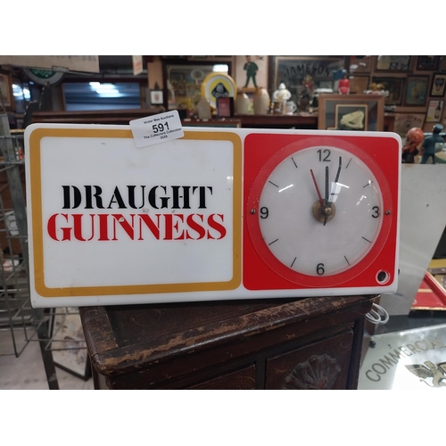 591 - Draught Guinness perspex advertising clock. {15 cm H x 31 cm W}.