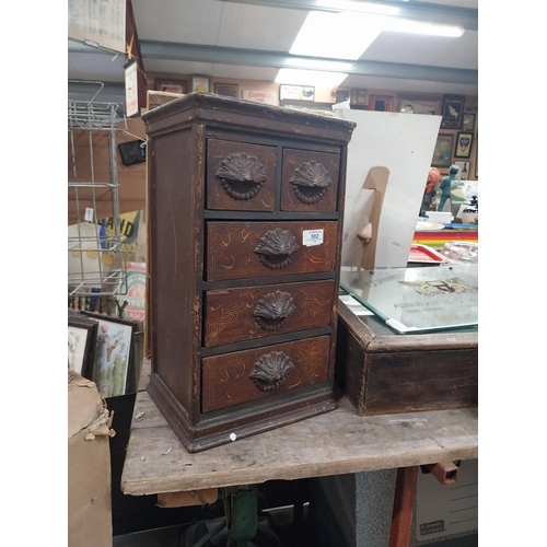 592 - 19th C. scumbled pine shop cabinet with two short drawers over three long drawers with carved wooden... 