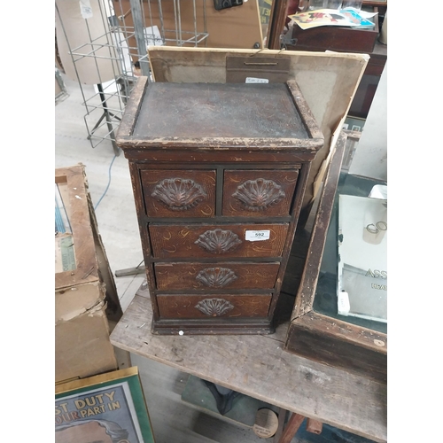 592 - 19th C. scumbled pine shop cabinet with two short drawers over three long drawers with carved wooden... 