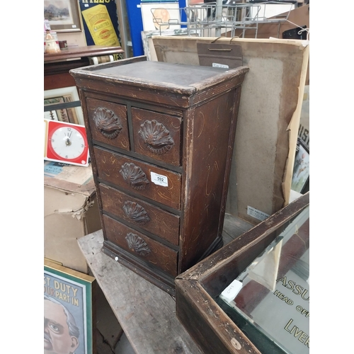 592 - 19th C. scumbled pine shop cabinet with two short drawers over three long drawers with carved wooden... 